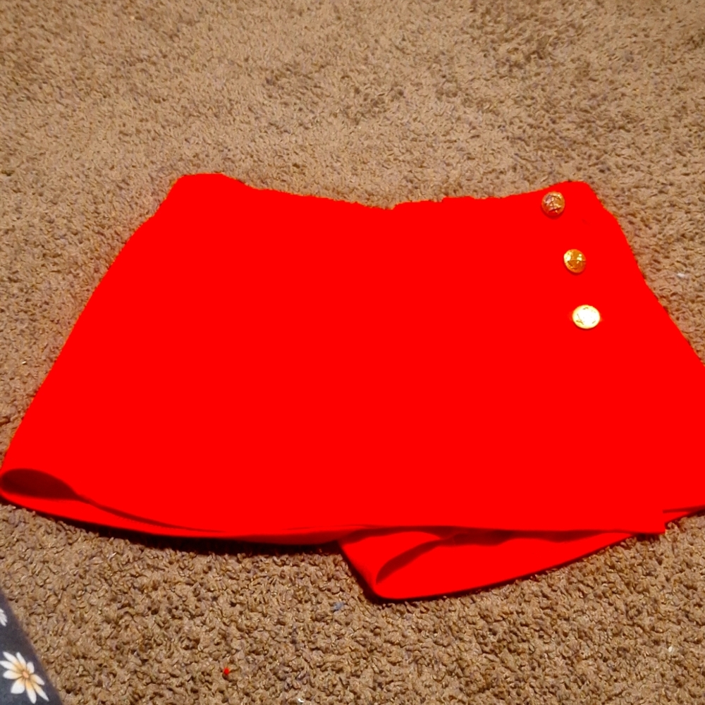 Red skort  3 gold color buttons on the side